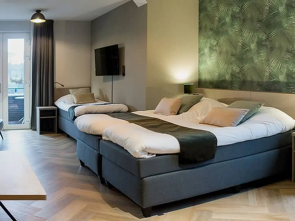 Driepersoons kamer Comfortabele slaapkamer voor drie personen met eigen badkamer en balkon